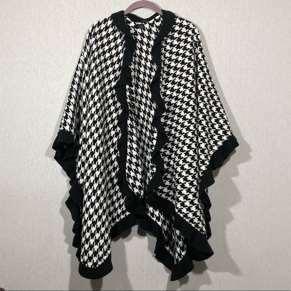 A poncho throw hounds to design one size